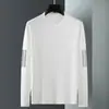 Camiseta casual versátil de manga larga para hombre para otoño, cuello redondo, color liso moderno, cómoda, transpirable y de corte holgado.