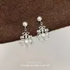 Sistema de color Maillard retro nicho minimalista de alta gama aretes de mariposa para otoño e invierno versátiles simples para el día a día