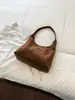 Bolso tote de gran capacidad para mujer, nueva versión coreana 2026, bolso de hombro versátil de moda de alta gama para el trabajo, retro, moderno