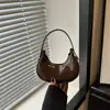 Bolso de Mano de Color Sólido con Forma de Media Luna Estilo Francés de Nicho Otoño 2026 Nuevo de Moda Casual Texturizado Bolso de Hombro para Debajo del Brazo