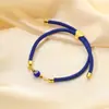 Europa y Estados Unidos pulsera ojo azul transfronteriza cuerda de mano ojo del diablo retro pulsera ojo tejida a mano ajustable venta al por mayor