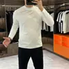 Camiseta de Manga Larga para Hombre Primavera y Otoño 2025, Algodón Puro, Diseño Liso, Marca de Moda, Corte Ajustado, Top de Color Sólido, Camisa Base Simple y Lujosa