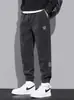 Pantalones gruesos de forro polar para hombre de marca de moda transfronteriza, pantalones casuales de retazos para otoño e invierno, pantalones cargo casuales de pana
