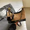 Bolsa feminina super popular em blocos de cores de nicho, nova bolsa transversal versátil outono e inverno 2026, bolsa de ombro única super popular estilo bolinho