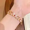 Xiaohongshu Mais Vendido Retro Esmalte Borboleta com Rubi Incrustado Pulseira Trançada Feminina Exquisite Joia de Mão de Nicho Atacado