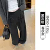 Pantalones casuales de cuadros negros y grises para mujer 2026 otoño e invierno nuevo estilo caída baja estatura lana franela holgados rectos de pierna ancha