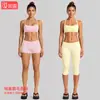 Conjunto de ropa de yoga transfronterizo con sujetador deportivo de cuello halter con sensación de segunda piel y conjunto de pantalones de fitness de secado rápido de cintura baja para correr y ciclismo al aire libre