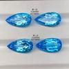 Anillo con superficie de gema de color natural y topacio azul suizo, aretes de gota de agua sin engarzar, aretes incrustados