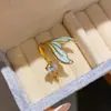 Anillo abierto de cola de pez redondo con goteo de aceite de circón lujoso y exquisito, joyería versátil de diseño de alta gama de nicho al por mayor