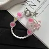 Cadena de cristal para teléfono nueva, única, con acabado mate y colgantes creativos de flores y estrellas, perfecta como llavero o charm para bolso.