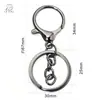 En stock Set de tres piezas con cierre de mosquetón bañado en rodio con anilla en O Cadena de cuatro secciones Anillo plano Joyería Figuras Bolsas Llaveros Colgantes