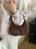 Bolso transfronterizo, diseño minimalista y único, bolso de hombro con lazo, versátil para el trabajo, bolso cruzado y un bolso de mano elegante