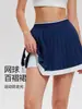 Falda plisada de tenis de cintura alta para mujer Cai Jue con diseño anti-exposición y bolsillos, adecuada para bádminton y golf, falda pantalón de línea A