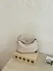 Bolsas de mano para mujer al por mayor para comercio exterior, nuevo modelo 2026, bolso tote de un solo hombro de alta gama, elegante bolso tejido estilo coreano para el día a día, estilo casual