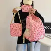 Conjunto de bolsa de três peças novo transfronteiriço mochila feminina para estudante universitária mochila de grande capacidade mochila casual de viagem versátil e moderna bolsa de ombro dupla