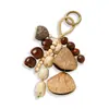 Cascabel de Concha de Fruta con Cadena de Semillas Retro Naturales que Cumplen Deseos Llavero de Semilla de Bodhi Colgante de Estilo Étnico Tejido a Mano para Bricolaje