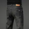 Jeans retro de alta gama para hombre, pantalones rectos de corte ajustado, pantalones versátiles elásticos de marca de moda, nuevo modelo primavera 2026