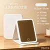 Espejo de maquillaje LED en stock al por mayor, espejo de escritorio plegable con luz de relleno, atenuación continua de tres colores con luz, suministro directo del fabricante
