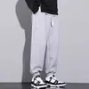 Calça casual masculina primavera calça de moletom plus size solta versátil extra grande tornozelo amarrado Esportiva calça masculina primavera e outono