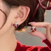 Pendientes Retro de Flor de Cuatro Hojas Diamantados de Doble Cara con Esmalte Goteante 2025 Otoño Nuevo Estilo Francés Modernos Pendientes de Alta Gama