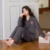 Pijamas de forro polar al por mayor listos para enviar para mujer, cárdigan de manga larga y pantalón largo de invierno, forro polar de seda y lana, ropa de casa para mujer transfronteriza para transmisión en vivo