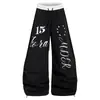 Design com Estampa de Letras Senso de Design Calça Wide Leg Corte Amplo Varre o Chão Masculino Vibe Streetwear Tendência Silhueta Solta Casual Calça Longa Color Blocking
