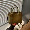 Bolso tejido de PU de alta gama para mujer, nuevo modelo 2026, bolso tipo cubo simple, bolso de hombro de moda de gran capacidad, bolso cruzado