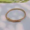 Fabricantes europeos y americanos de pulseras de espiral retráctil de acero inoxidable suministran pulsera de pulsera chapada en oro al por mayor transfronterizo