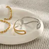 Diseño silencioso acero inoxidable oro de 18 quilates color oro y plata a juego líneas minimalistas pulsera abierta hueca anudada en espiral