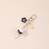 Amuleto Cerámica Gato de la Suerte Llavero Dibujo Animado Imagen de Gato de la Suerte Elemento de Amuleto Accesorios Colgantes para Hombres y Mujeres Colgante de Bolsa