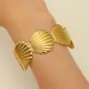 Pulseiras Largas Europeias e Americanas de Aço Inoxidável de Alta Resistência com Espiral Ondulado, Estrela do Mar, Esmalte Azul e Designs de Concha em Vários Estilos para uma Vibe Praiana