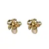 Pendientes de flor de ojo de gato de metal estilo francés para mujer, ligeros, lujosos, vintage, exquisitos, con diseño de nicho para otoño e invierno.