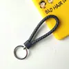 Llavero creativo de cuerda de cuero tejido a mano para pareja, llavero de coche, llavero al por mayor, colgante para bolso