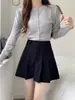 Shorts casuales plisados adelgazantes de cintura alta 2026 otoño/invierno de pana línea A pantalones-falda holgados para mujeres petite shorts de pierna ancha