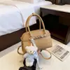 2026 Nuevo Bolso Cuadrado Pequeño Estilo Minimalista Bolso de Mano Exquisito Versátil Bolso de Hombro de Moda Bolso Cruzado de Diseño de Nicho de Moda