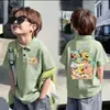 Camisa Polo Fina de Manga Curta 100% Algodão para Meninos e Meninas Verão 2026 Novo Estilo Infantil Versátil Estampada com Gola