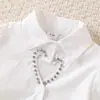 Baoxin Verano Nuevo Estilo Europeo y Americano Camisa Hueca con Forma de Corazón y Falda Bodycon con Flor Tridimensional Conjunto de Moda Elegante en Stock