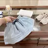 Conjunto de Niña 2026 Verano Nuevo Elegante Chaleco de Punto Polo y Falda Corta a Cuadros Conjunto de Dos Piezas Moderno