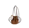 Bolso de Cubo con Cordón de Moda para Mujer 2026 Otoño Nuevo Estilo Versión Coreana para Mujer Bolso de Hombro Único de Cuero Suave Bolso Cruzado de Nicho de Gama Alta
