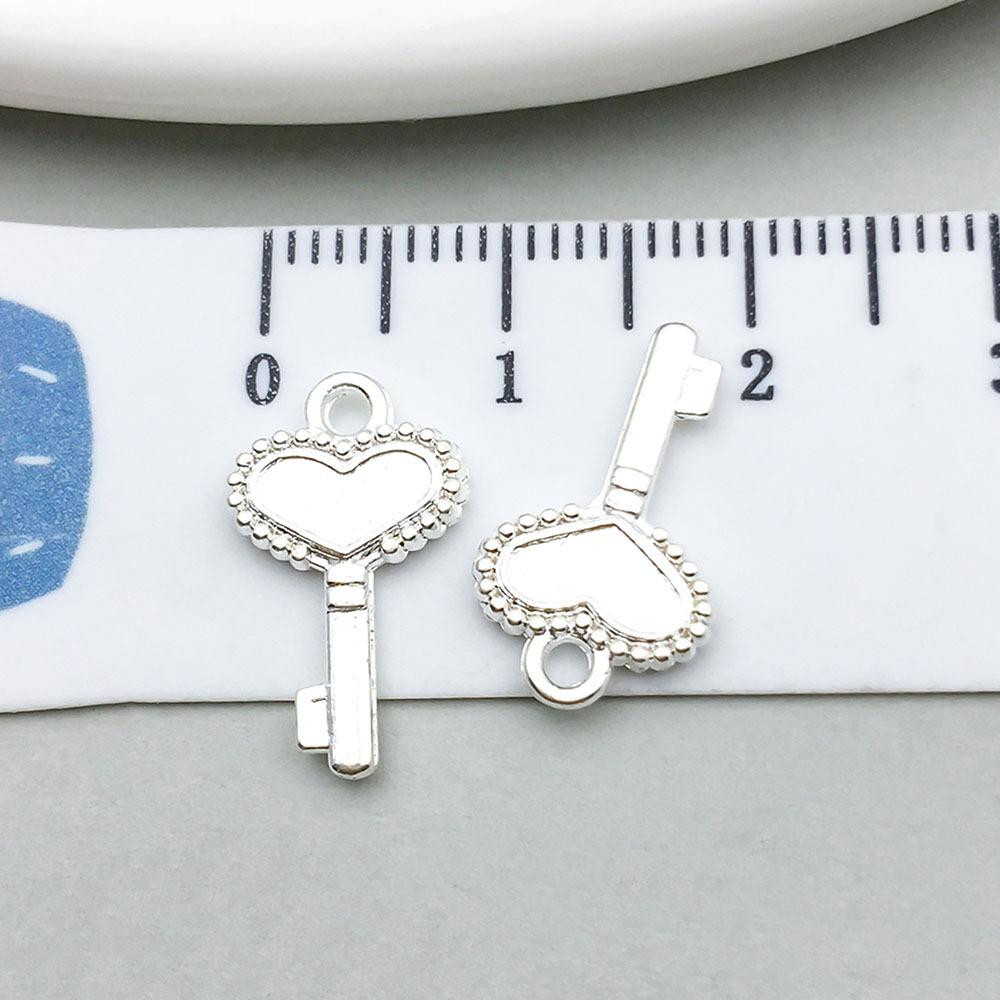 20959-X-亮银锌合金桃爱心形钥匙10x17-0.6g.