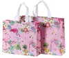 Bolsa no tejida en stock Impresión a color de película Bolso de mano para llevar ropa a domicilio Regalo publicitario Bolsa de compras promocional al por mayor