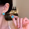 Aretes de aro huecos estilo retro europeo y americano para mujer, a la moda, lujo ligero, aretes elegantes de alta gama en turquesa estilo francés