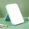 Espelho de maquiagem 3D de plástico de cor sólida, espelho de toucador 3D portátil, espelho pequeno dobrável de alta definição para mesa de dormitório de estudante