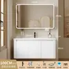 Tocador de baño engrosado y ahorrador de espacio con diseño en color crema, que cuenta con un lavabo redondeado, lavabo cerámico integrado y un lavabo de una sola pieza.