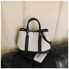 Bolsa de Mão de Luxo Modelo Saco Feminina Nova Primavera 2026 Versátil Bolsa Tote de Lona Popular Bolsa Transversal