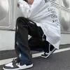 Estilo vibe europeo y americano jeans negros de pierna recta holgados para hombre marca de moda ins hip hop costuras rudo guapo calle alta pantalones largos
