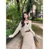 Nuevo conjunto de dos piezas para mujer de verano: suéter de punto hueco, camisa de aire acondicionado, top, cárdigan, chaqueta y falda para mujer