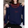 Camiseta feminina de manga longa com gola e punhos em algodão puro em cores contrastantes, moderna e versátil, blusa que rejuvenesce, novo modelo outono 2026
