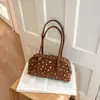 Bolsa de bowling de nicho estilo coreano, nova coleção outono 2026, bolsa de ombro de grande capacidade, bolsa almofada moderna e estilosa para trabalho e deslocamento