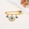 Broche de Borla Olho de Diabo Cravejado de Diamantes Criativo Europeu e Americano, Broche de Estilo Frio para Suéter de Cintura com Olhos Azuis de Alta Qualidade
